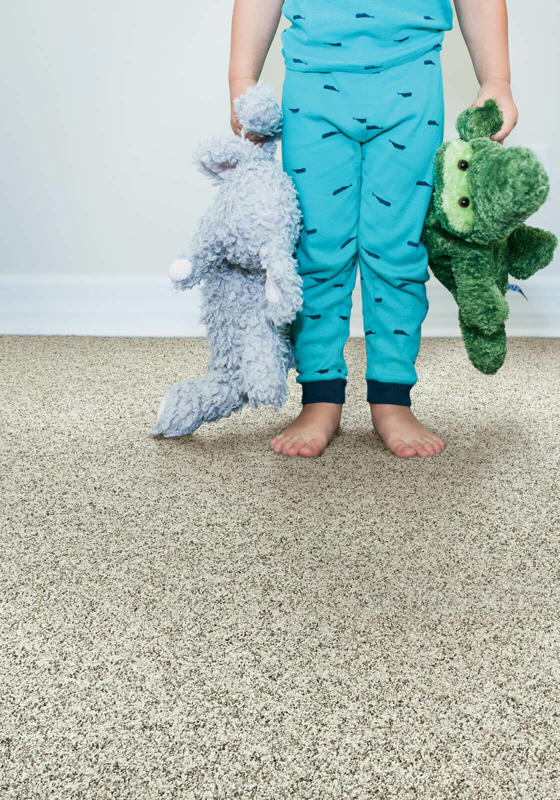 Kid with toys | Contractors Carpet & Flooring